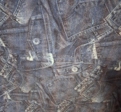 Close-up of denim fabric with a pattern of jeans shapes.[designerspandexandmore.com]